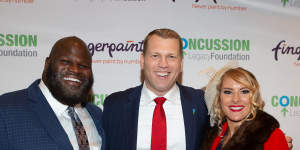 Concussion Legacy Foundation founder Chris Nowinski (centre) with WWE Superstars Mark Henry and Lacy Evans at the annual Concussion Legacy Gala,in October 2019. 