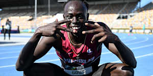 Gout Gout celebrates his 100-metre victory at the Australian Athletics junior championships on Saturday.