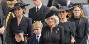 Kate,Princess of Wales,from left,Princess Charlotte,Prince George,Camilla,the Queen Consort,Meghan,Duchess of Sussex and Princess Beatrice follow the coffin of Queen Elizabeth II following her funeral service in Westminster Abbey.