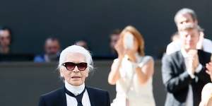 Karl Lagerfeld acknowledges applause after the presentation of Chanel's Haute Couture Fall/Winter 2017/2018 fashion collection in Paris.