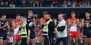 First responders of the Bondi terror attack and Ahmed Al Ahmed,the hero who wrestled a gun from one of the shooters,are acknowledged during the 2026 AFL Opening Round match between the Sydney Swans and the Carlton Blues at the Sydney Cricket Ground on Thursday.