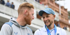 New captain Ben Stokes shares the moment with his predecessor Joe Root.