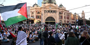 People block the Flinders Street intersection during a pro-Palestinian protest on Thursday afternoon.