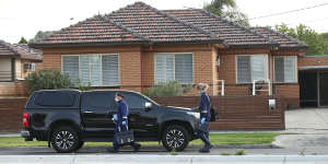 Forensic police work at the scene of the fatal shooting on Friday morning. 