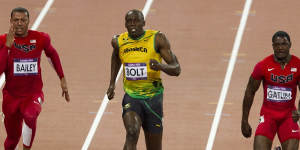Rivals:Usain Bolt wins the London Games 100m final. Justin Gatlin,right,took bronze. 