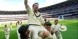 Australia’s Shane Warne is carried on the shoulders of teammates Andrew Symonds and Matthew Hayden in 2006 after his final Test match at the MCG.
