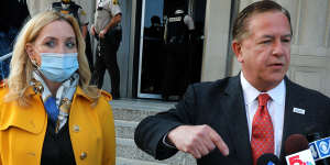 Mark McCloskey addresses the media alongside his wife Patricia on Tuesday,outside the Carnahan Courthouse in St. Louis.