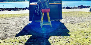 Pianos for the People founder Yantra de Vilder tickles the ivories at Avoca Beach.