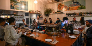 At La Pinta,diners gather around the U-shaped bar.