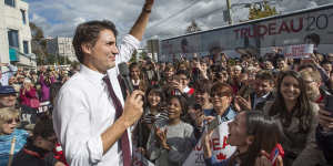 Trudeaumania mark II:New Canadian Prime Minister waves to supporters on a campaign stop last week. 