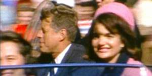 President John F Kennedy and first lady Jackie in their Dallas motorcade shortly before the shots were fired.
