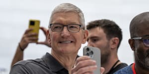 Apple chief Tim Cook with the latest iPhone,the 15 Pro Max.