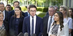 Nationals leader David Littleproud surrounded by his colleagues as they announce their opposition to the Voice referendum.