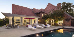 The outdoor entertaining area has a swimming pool and room to add a tennis court if the new owner wishes.