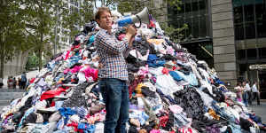 War on Waste host Craig Reucassel with six tonnes of fashion waste.