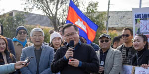 Victorian MP Meng Heang Tak (centre) and former MP Hong Lim (left) were named on a hit list in a warning letter sent to Tak’s office last year.