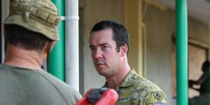 Army Captain Brenton Cathie in the Lekutu Secondary School Australia is helping to build.