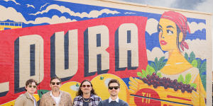 Kings of Leon,l-r:Matthew Followill (lead guitar),Caleb Followill (lead vocals,guitar),Nathan Followill (drums) and Jared Followill (bass) in front of the Mildura mural.