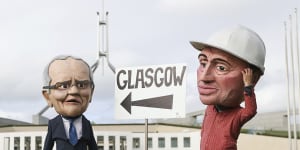 Protestors dressed as Prime Minister Scott Morrison and Deputy Prime Minister Barnaby Joyce on the lawns of Parliament House on Thursday.