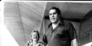 Andre the Giant and Qantas senior passenger agent,Jane Symond,on arriving in Sydney on a 1984 visit.