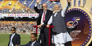 Chants,linked arms and a batmobile:Modi’s absurd theatre takes over the cricket