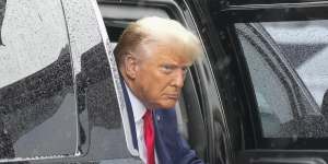 Former president Donald Trump arrives to board his plane at Ronald Reagan Washington National Airport.