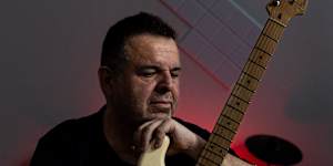 NDIS music therapist Juan Torres at his music studio in Sydney. 