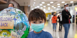 Hiro Xu,7,holding a balloon and a koala toy given to him by Tourism Australia’s welcoming team greeting travellers flying to Australia from Singapore on Sunday. 