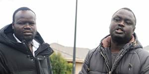 Elbino Akueng,right,pleads for justice after his 15-year-old son,Dau Akueng,was stabbed to death in Cobblebank.