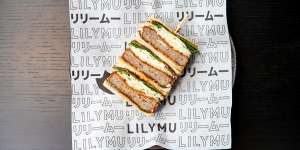 Duck katsu sando with layers of crumbed minced duck,chilli jam,raw shredded cabbage and Thai herbs.