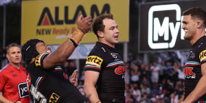 Nathan Cleary (right) celebrates after his late try.