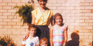 Pauline Hanson in the front yard of the family home in Ipswich with three of her children:Adam,Lee and Amanda.