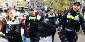 A protester is arrested during the Land Forces expo demonstrations in September. 