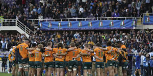 The Wallabies gather in a circle after losing to Italy in Florence.