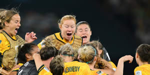 A night for the ages:The Matildas come together after the winning penalty.