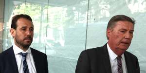 Peter Minucos,left,leaving the ICAC on Monday.