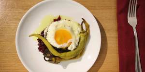 Pickled beetroot and fried egg dish.