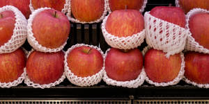Apples individually packaged at a Japanese supermarket.