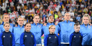The Lionesses sing the anthem at a sold-out Stadium Australia.