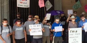 Senior activists tape mouths shut protesting Brisbane library ban