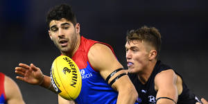 Christian Petracca,left,and Patrick Cripps,right,in action during Saturday night's thriller. 