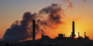 A coal-fired power plant is silhouetted against the morning sun in Glenrock,Wyoming. The Trump administration is rollingback Obama-era regulations designed to rein in climate-changing fossil-fuel emissions.