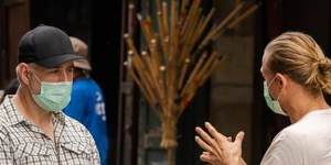 Showrunner Steve Lightfoot and leading man Charlie Hunnam discuss a scene on the set of Shantaram. 