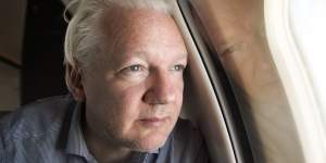 Julian Assange on board the plane that took him from Britain to Bangkok.