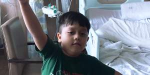 Mikolaj Barman playing with balloons the day before his operation.
