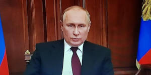 Russian President Vladimir Putin announcing plans to sign a decree on eastern Ukraine regions.