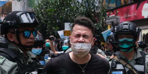 Andrew Wan,a pro-democracy lawmaker,is arrested by riot police during a protest in Hong Kong on Wednesday.