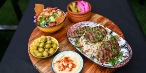 Shish kofta platter with fattoush,pickles and hummus.