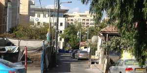 Kunder Street in Sheikh Jarrah,East Jerusalem. The Israeli flag can be seen on the right,hanging on the house from which the Shamasneh family were evicted in September 2017. 