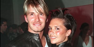 David and Victoria Beckham attend a Versace Store opening party in London in 1999. The pair became notorious for wearing matching outfits. 
